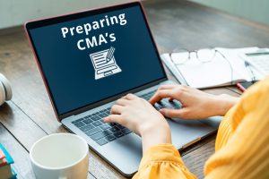 Woman's Hands tpoing on a computer laptop Preparing CMA's